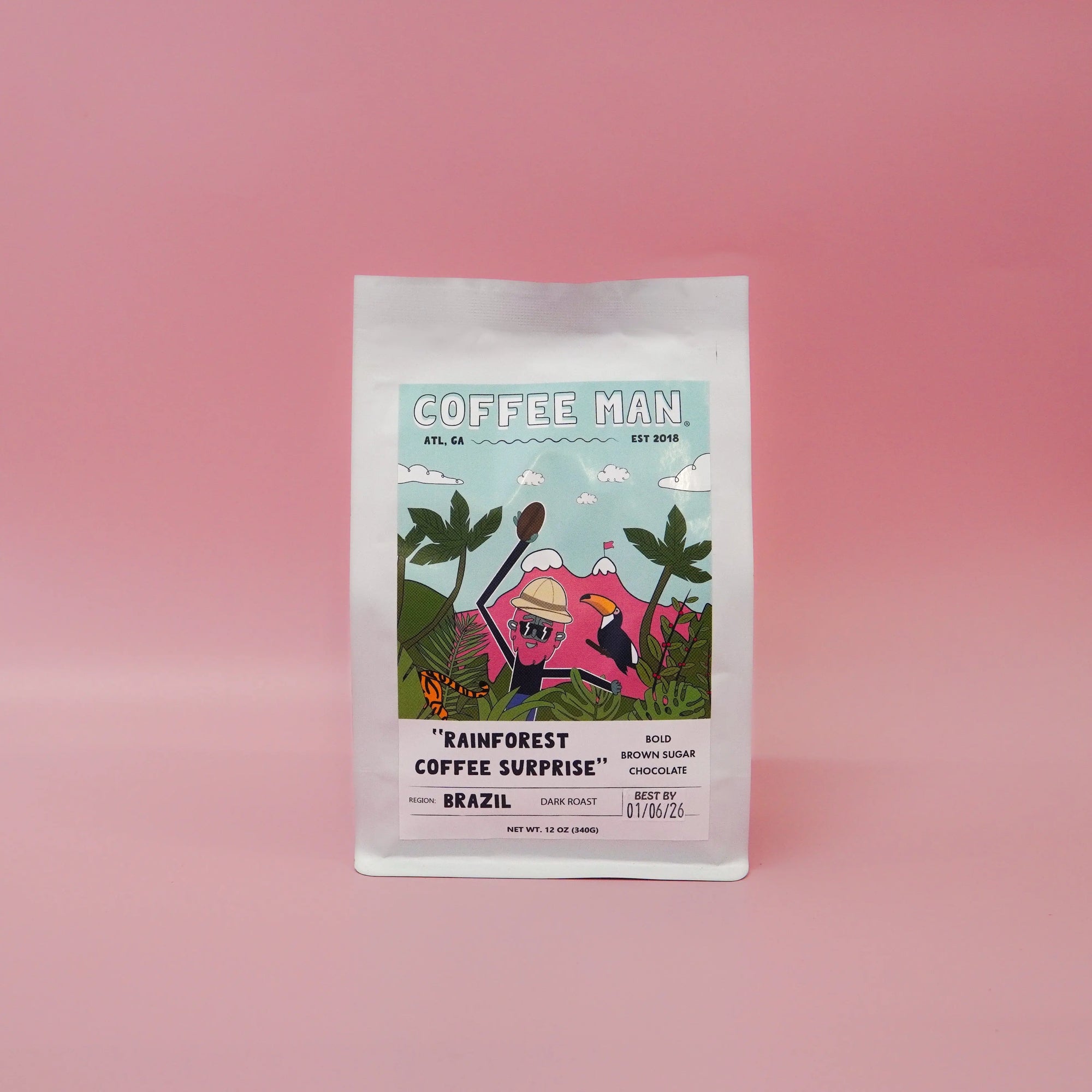 white brazilian coffee bag with doodles of a cartoon in the rainforest holding a coffee bean