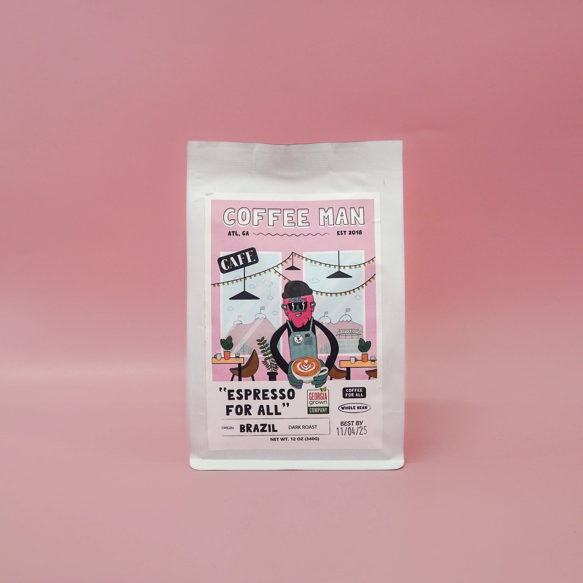 twelve ounce white Brazilian coffee bag with colorful doodles of a cartoon on the label