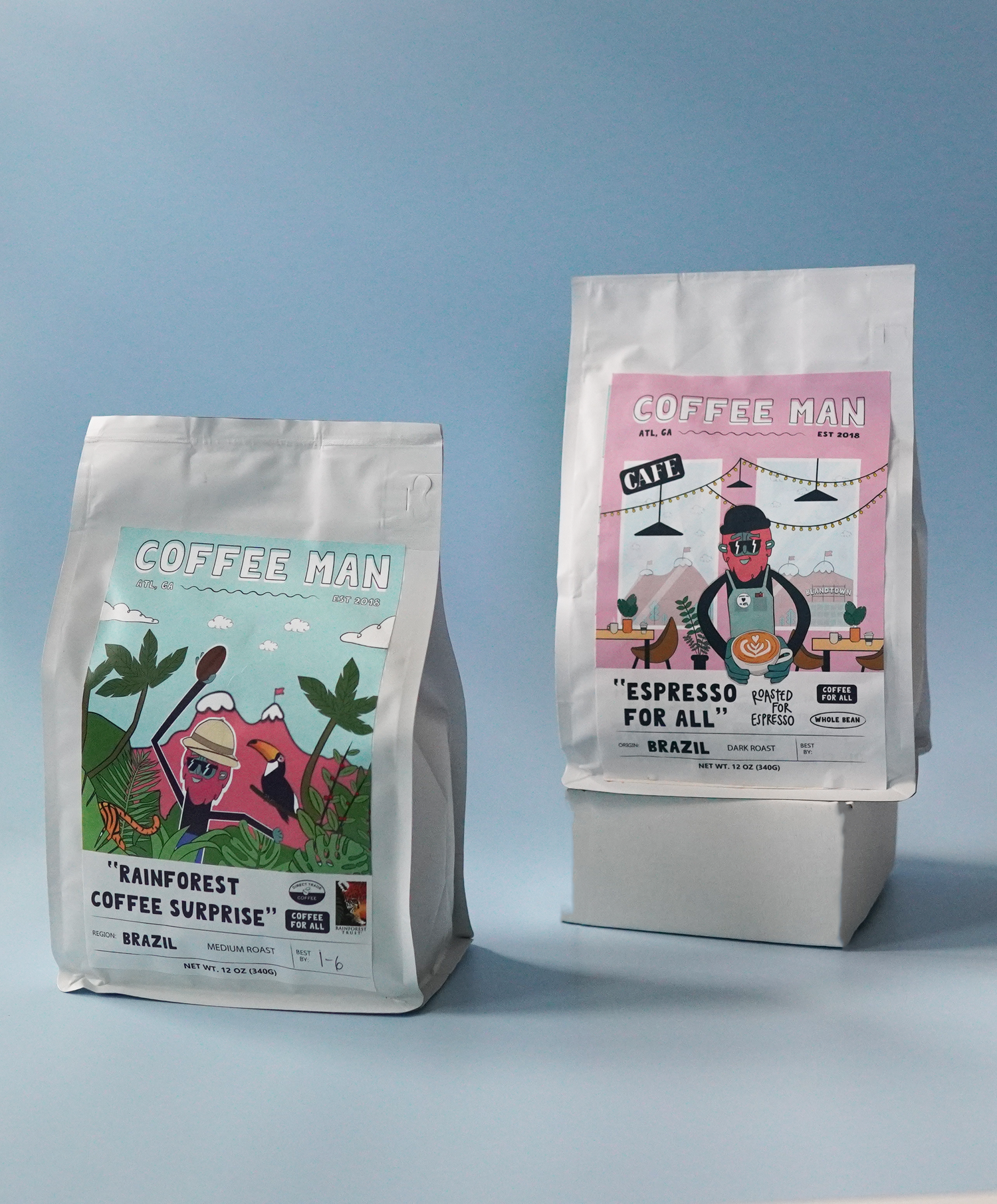 two different white coffee bags holding dark and medium roast beans