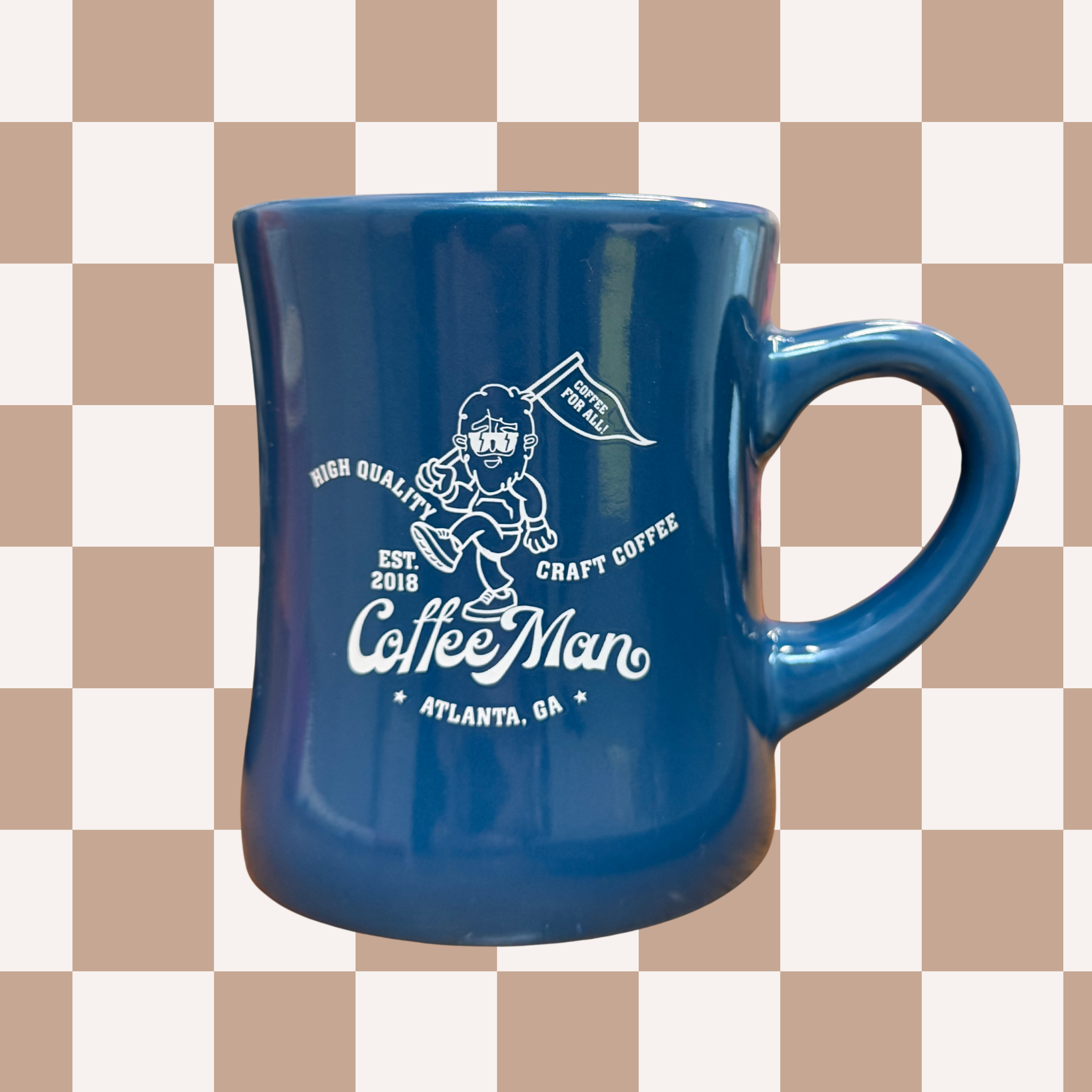 Blue diner mug with white graphics and text on a checkered background