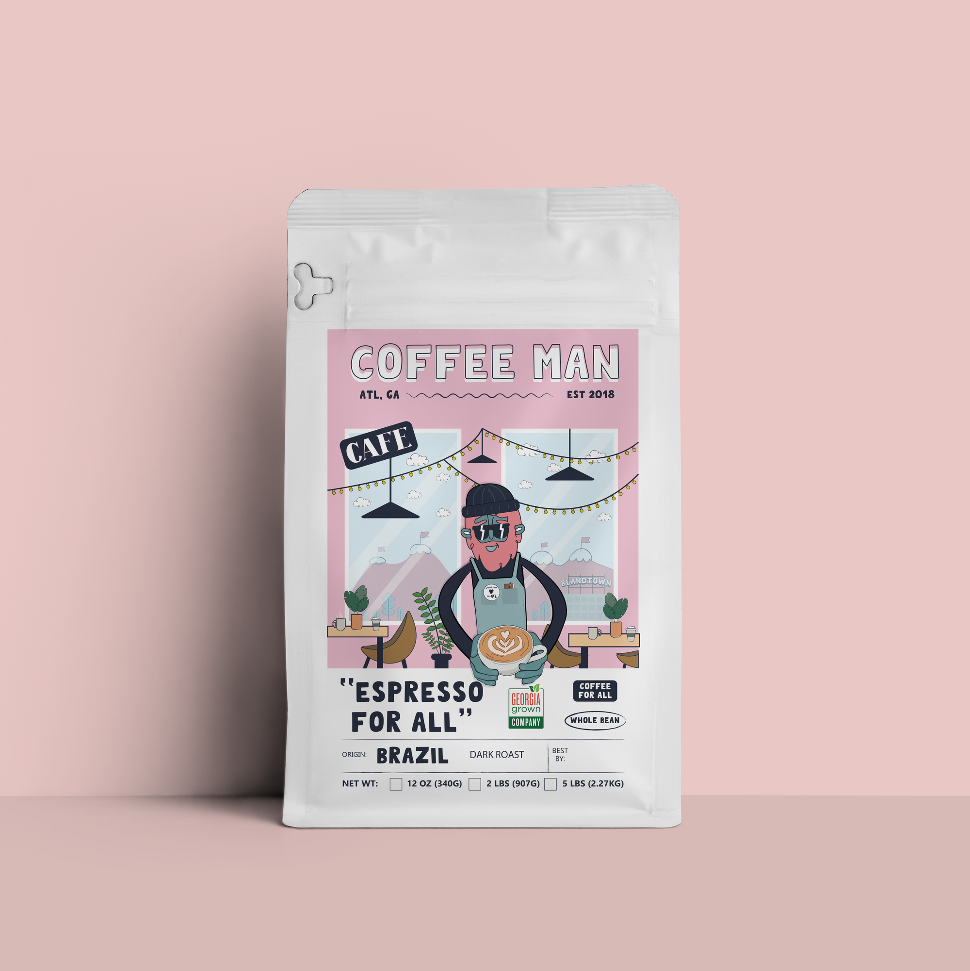 Coffee Man Brazil Espresso For All 12oz bag of dark roast whole bean coffee featuring bold chocolate and brown sugar notes.