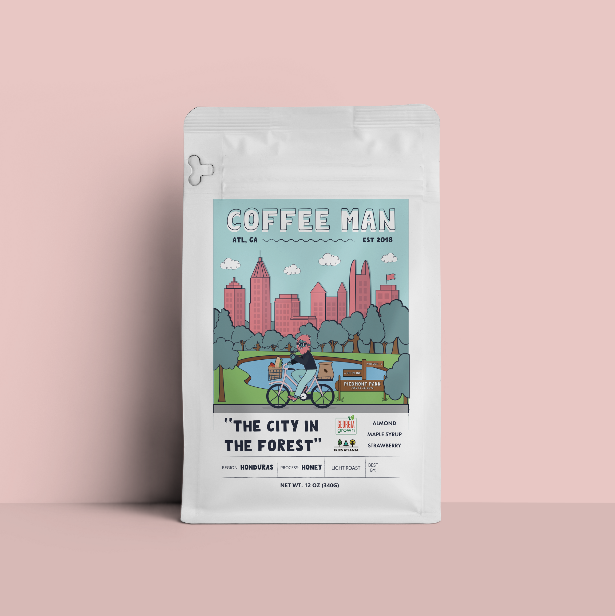 Coffee package with 'Coffee Man' branding on a pink background